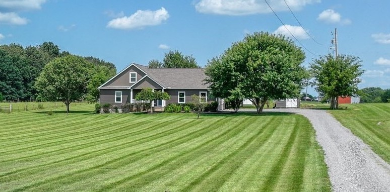 a front view of a house with a yard