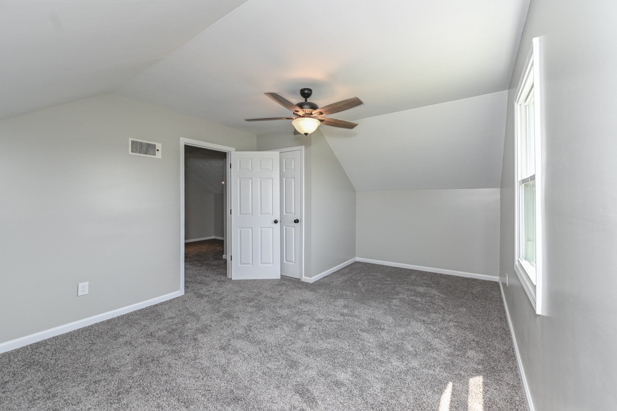 606 Cook Road Portland, TN 37148 - Photo 14 of 17 an empty room with ceiling fan and window