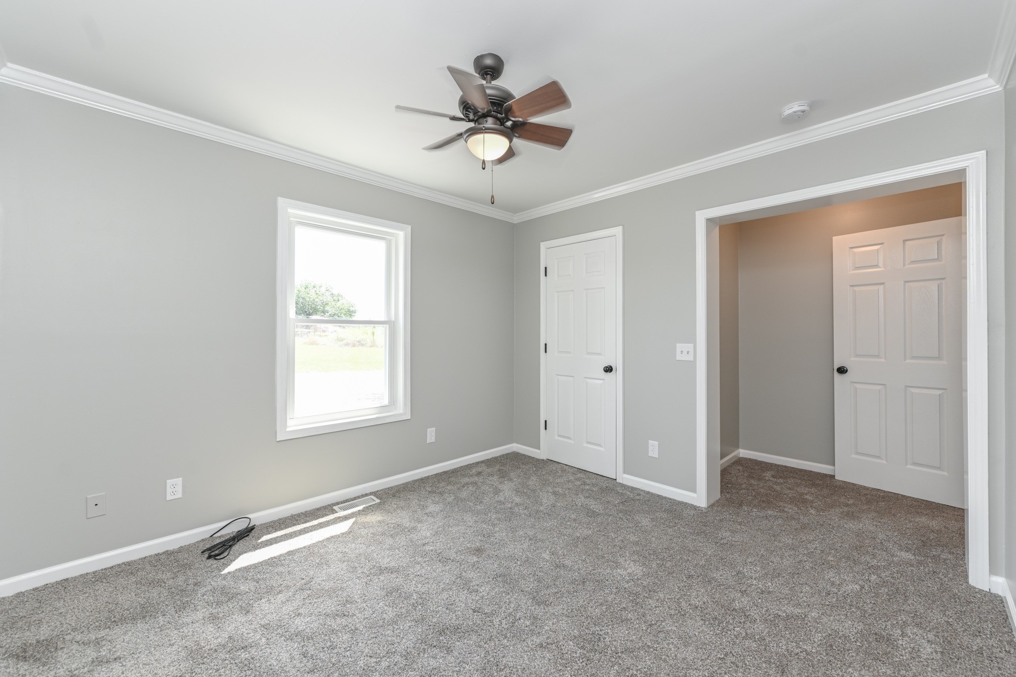 606 Cook Road Portland, TN 37148 - Photo 8 of 17 a view of a livingroom with a ceiling fan & windows
