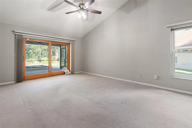 a bedroom with bed and a chandelier