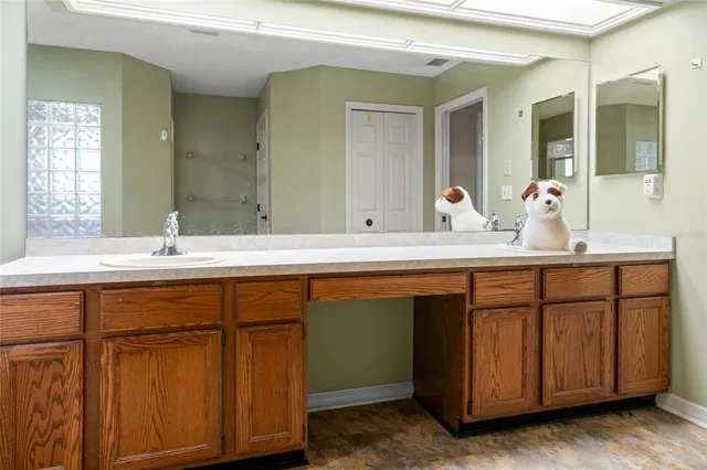 a view of kitchen with stainless steel appliances granite countertop a stove and a sink