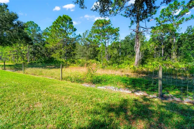 an aerial view of a house with a garden