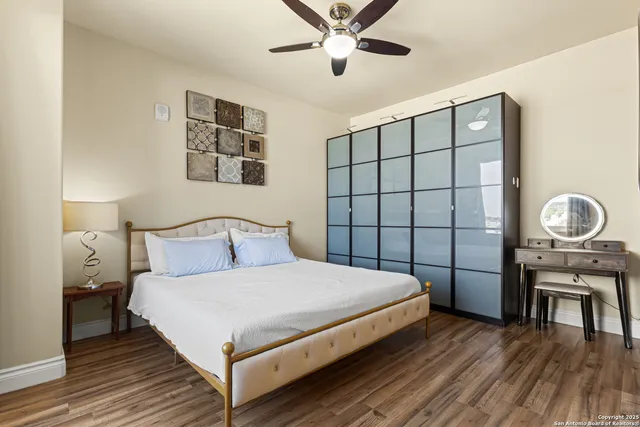 a bedroom with a bed and a table