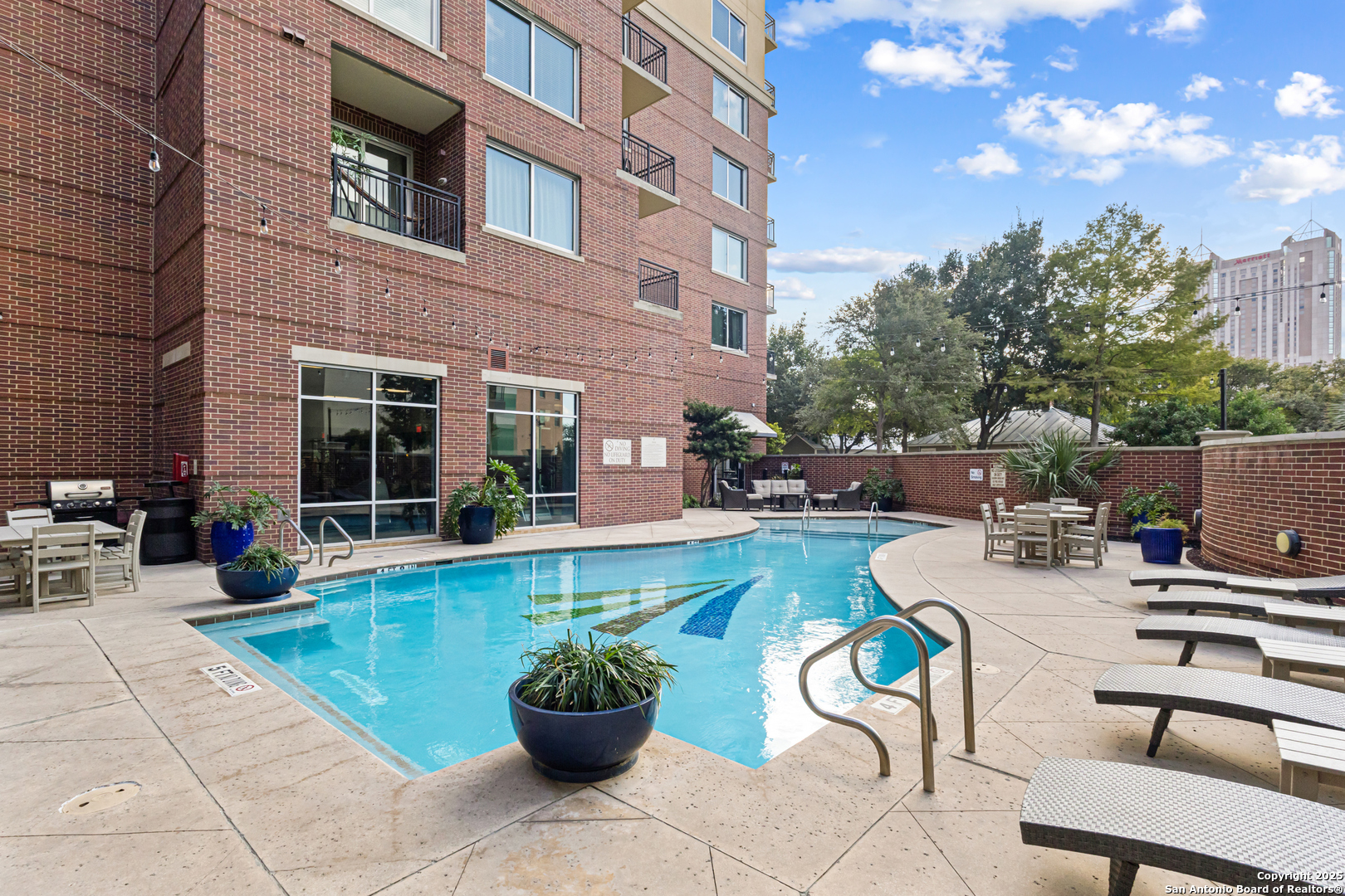 215 Center Street, Unit 1005 San Antonio, TX 78202 - Photo 18 of 29 a view of a patio with couches and potted plants
