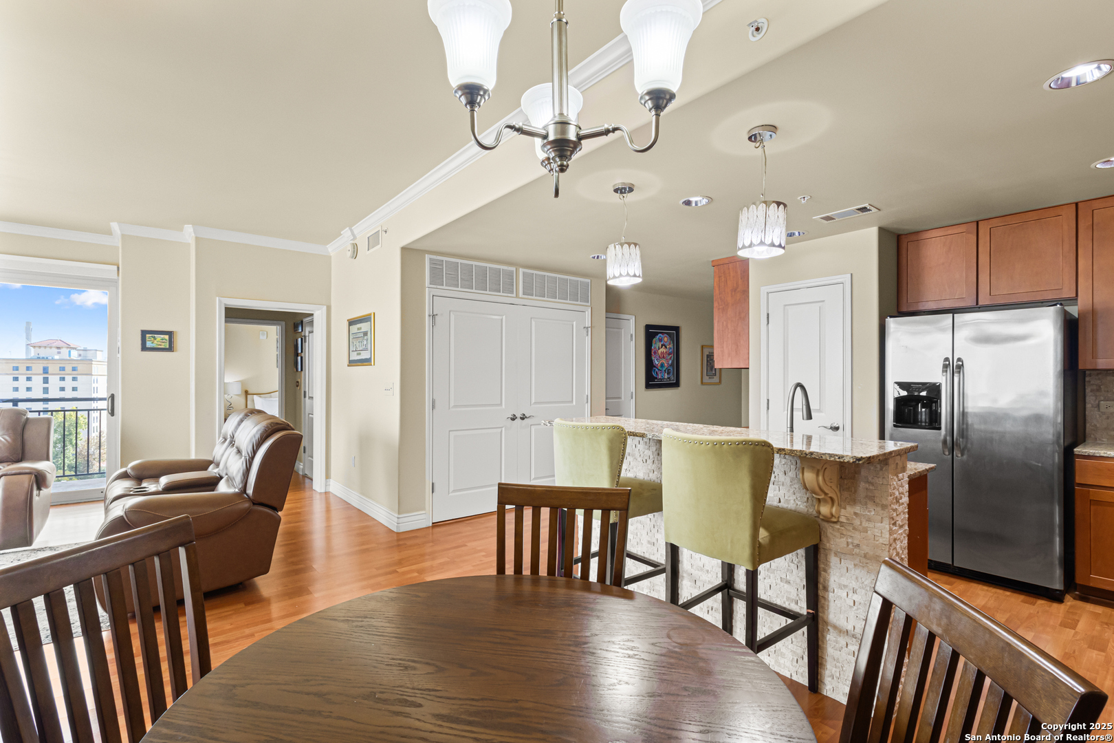 215 Center Street, Unit 1005 San Antonio, TX 78202 - Photo 5 of 29 a view of kitchen with refrigerator and wooden floor