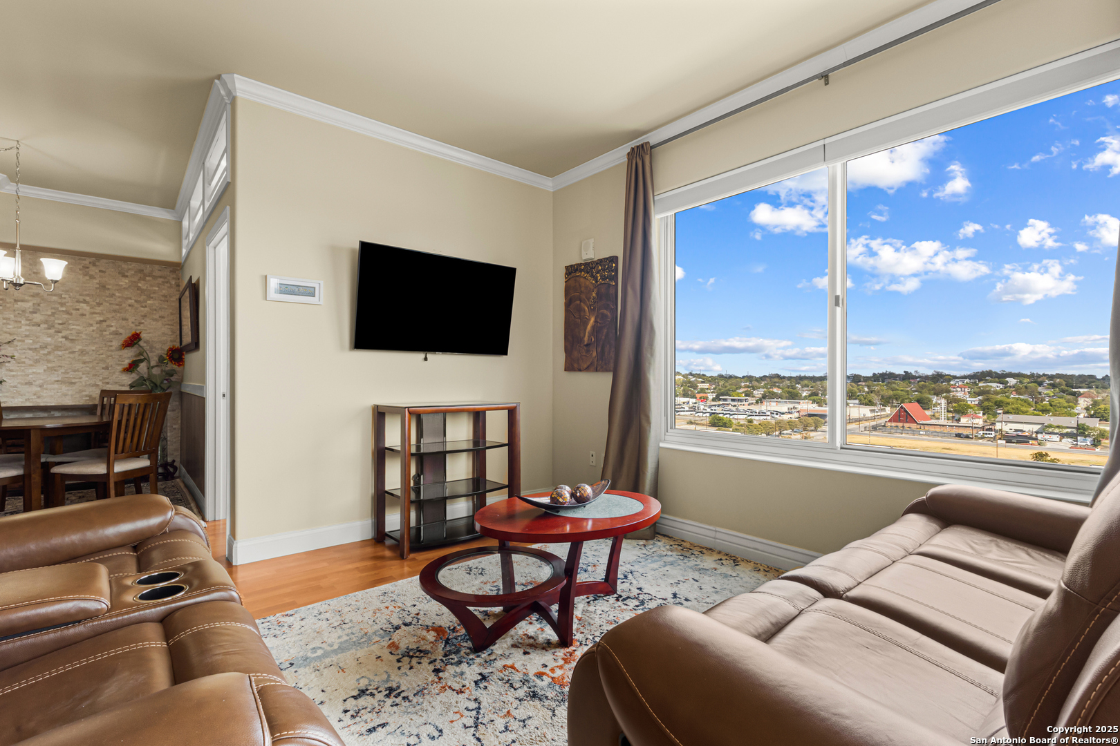 215 Center Street, Unit 1005 San Antonio, TX 78202 - Photo 8 of 29 a living room with furniture and a flat screen tv