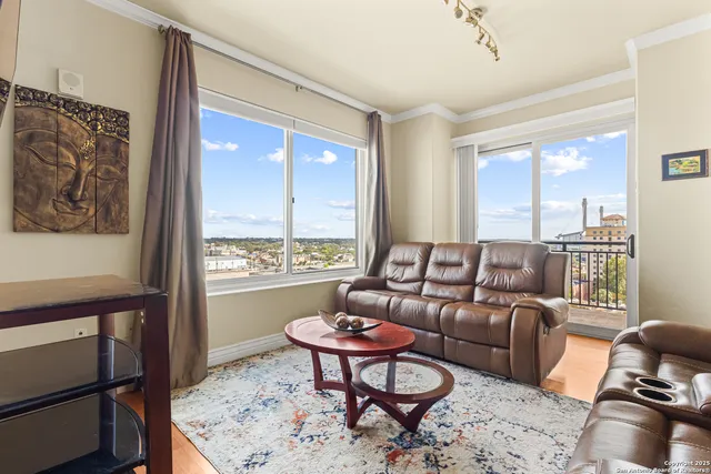 a living room with furniture and a window