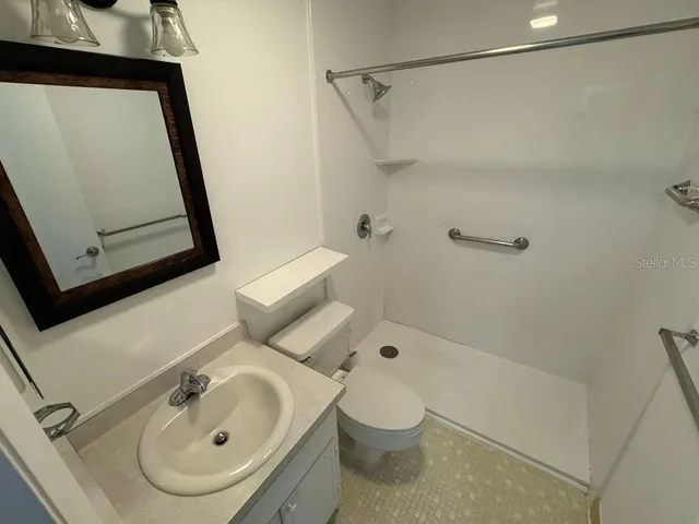 a room with water heater and storage racks