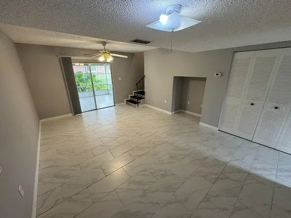 a view of an empty room with a window