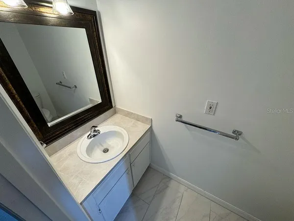 a bathroom with a sink and washing machine