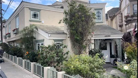 a view of a house with plants and trees