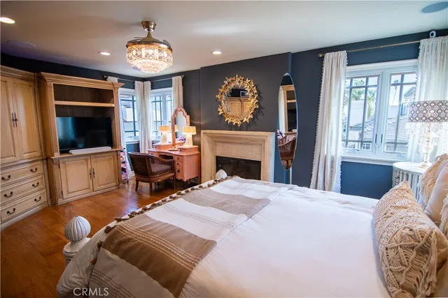 a bedroom with furniture and a fireplace