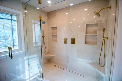 a bathroom with a shower and a toilet