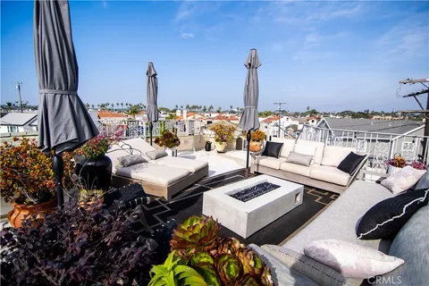 a bed room with furniture and a floor to ceiling window