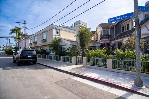a view of street with parked cars