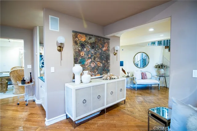 a living room with furniture and a mirror