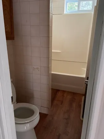 a bathroom with a toilet and a sink