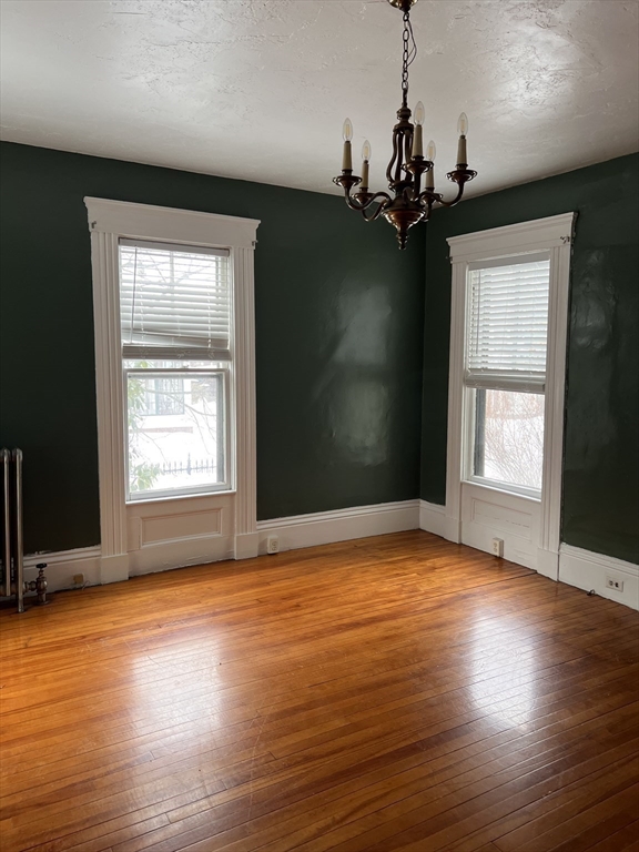 1 Congress Street, Unit 1 Worcester, MA 01609 - Photo 3 of 15 a view of empty room with wooden floor and fan