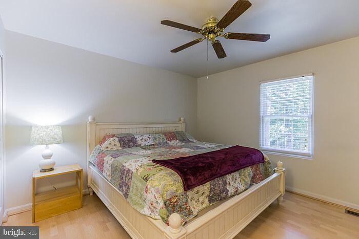 3450 Allday Road Huntingtown, MD 20639 - Photo 14 of 23 a bed sitting in a bedroom next to a window