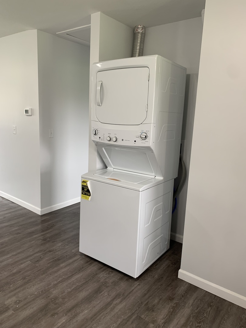 730 South High Street Paxton, IL 60957 - Photo 14 of 14 a utility room with wooden floor washer and dryer