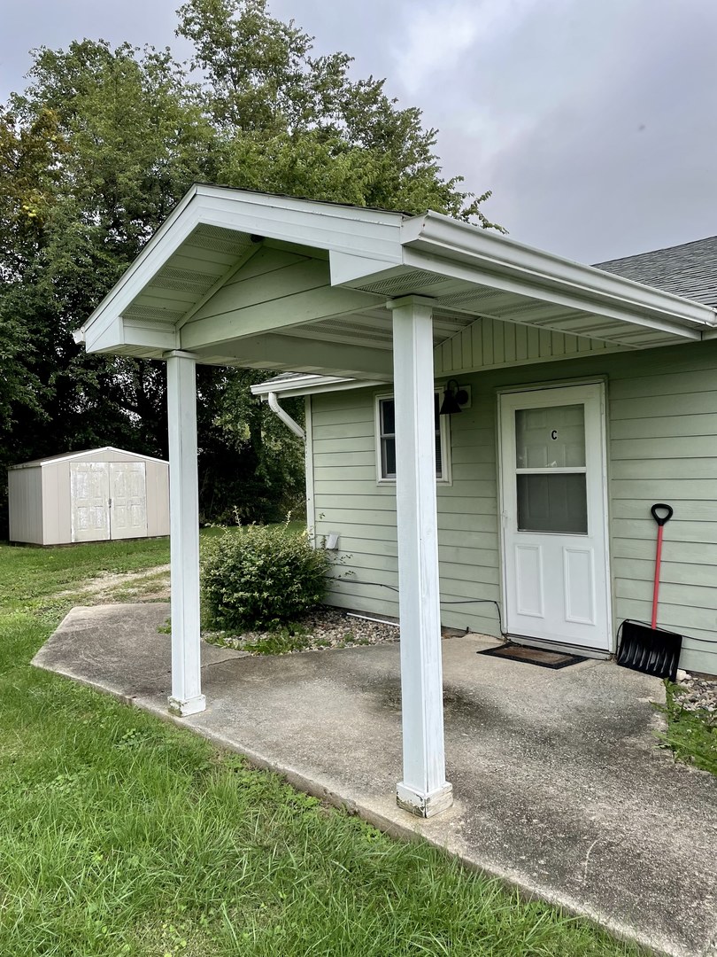 730 South High Street Paxton, IL 60957 - Photo 2 of 14 a front view of a house with garden