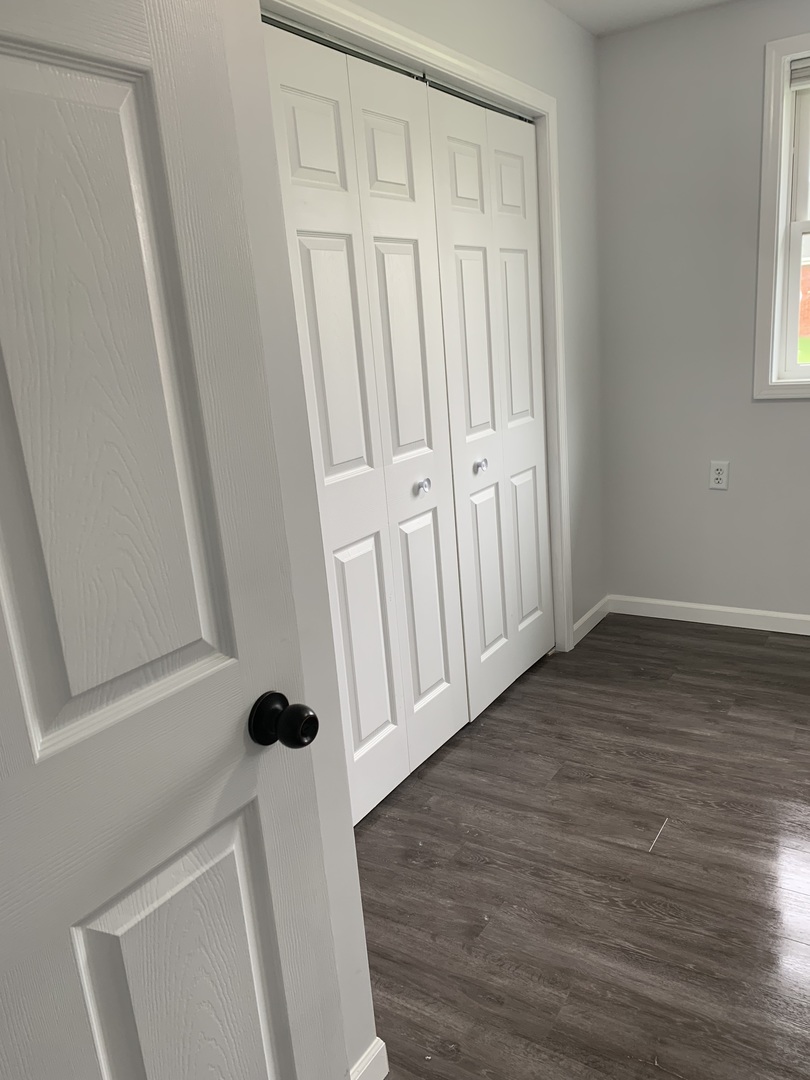 730 South High Street Paxton, IL 60957 - Photo 8 of 14 a view of an entryway with wooden floor