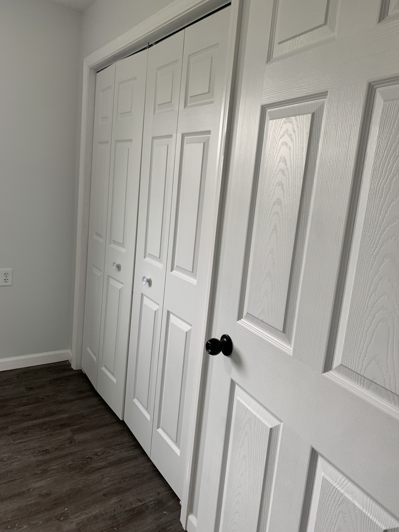 730 South High Street Paxton, IL 60957 - Photo 10 of 14 a view of a hallway with wooden floor and staircase