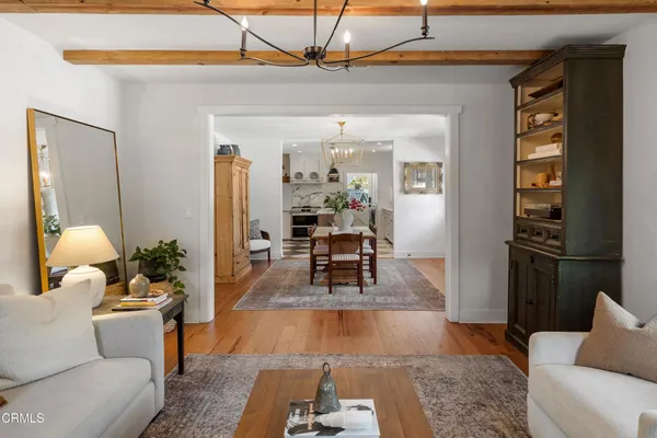a living room filled with furniture and a table