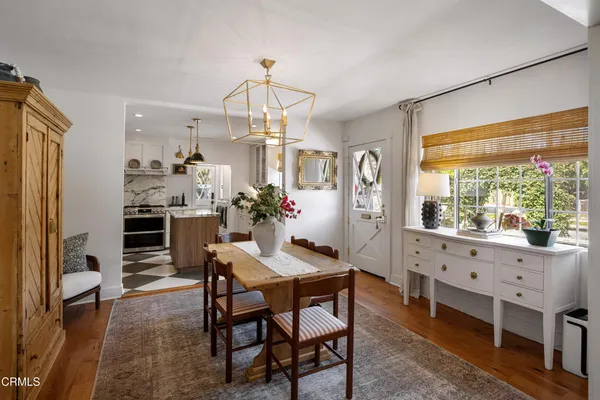 a view of a dining room with furniture window and outside view