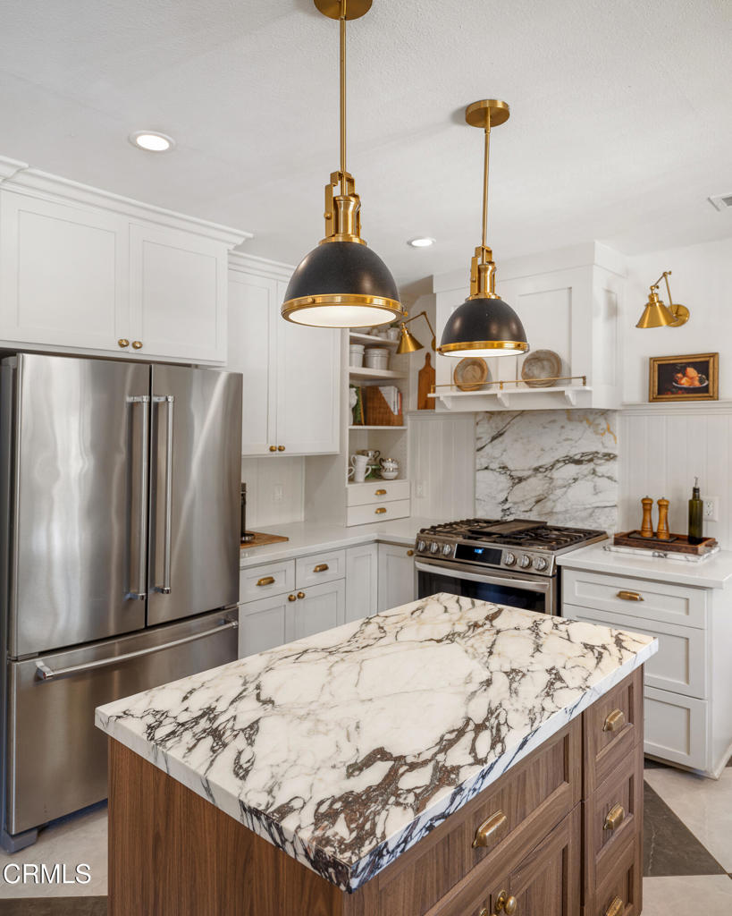 640 East Rio Grande Street Pasadena, CA 91104 - Photo 17 of 61 a kitchen with stainless steel appliances granite countertop a sink a stove and a refrigerator