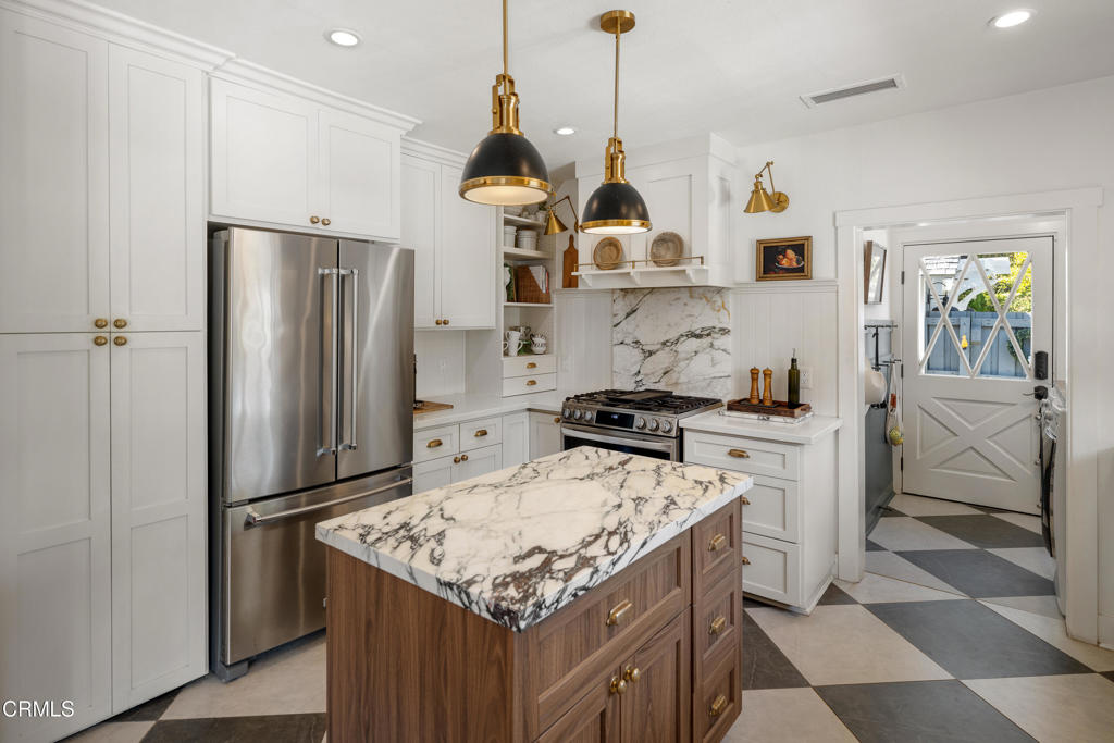 640 East Rio Grande Street Pasadena, CA 91104 - Photo 18 of 61 a kitchen with stainless steel appliances granite countertop a refrigerator a stove and a sink