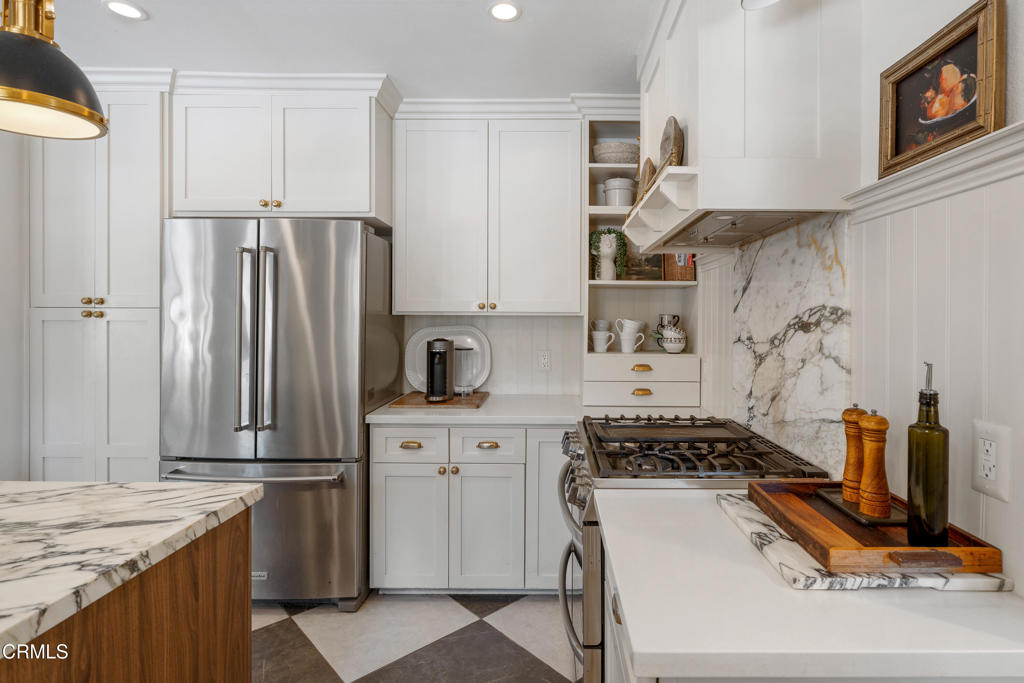 640 East Rio Grande Street Pasadena, CA 91104 - Photo 19 of 61 a kitchen with stainless steel appliances granite countertop a stove and a refrigerator