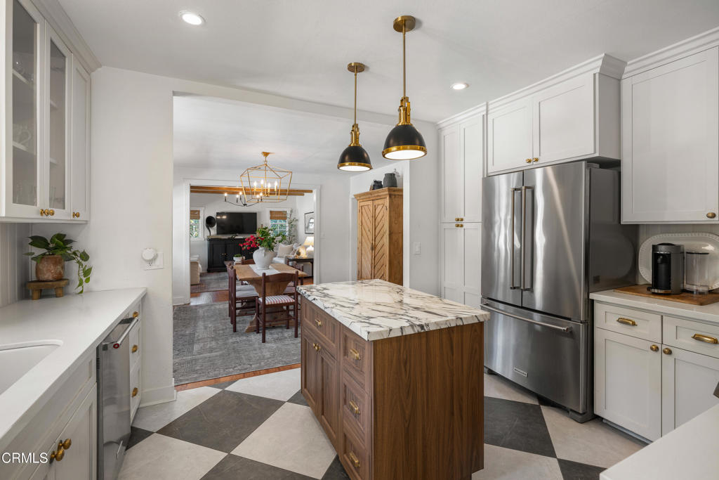 640 East Rio Grande Street Pasadena, CA 91104 - Photo 22 of 61 a kitchen with stainless steel appliances granite countertop a refrigerator a sink a stove and white cabinets