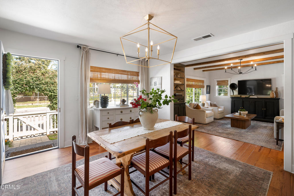 640 East Rio Grande Street Pasadena, CA 91104 - Photo 3 of 61 a dining room with furniture a chandelier and wooden floor