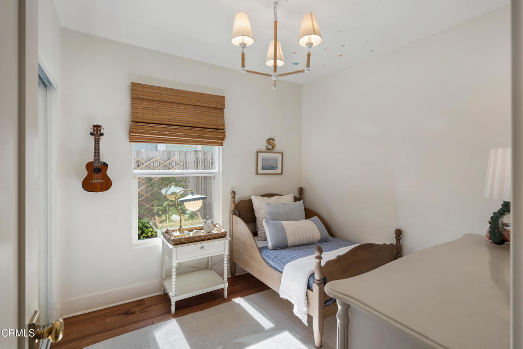 640 East Rio Grande Street Pasadena, CA 91104 - Photo 31 of 61 a bedroom with a bed and a window