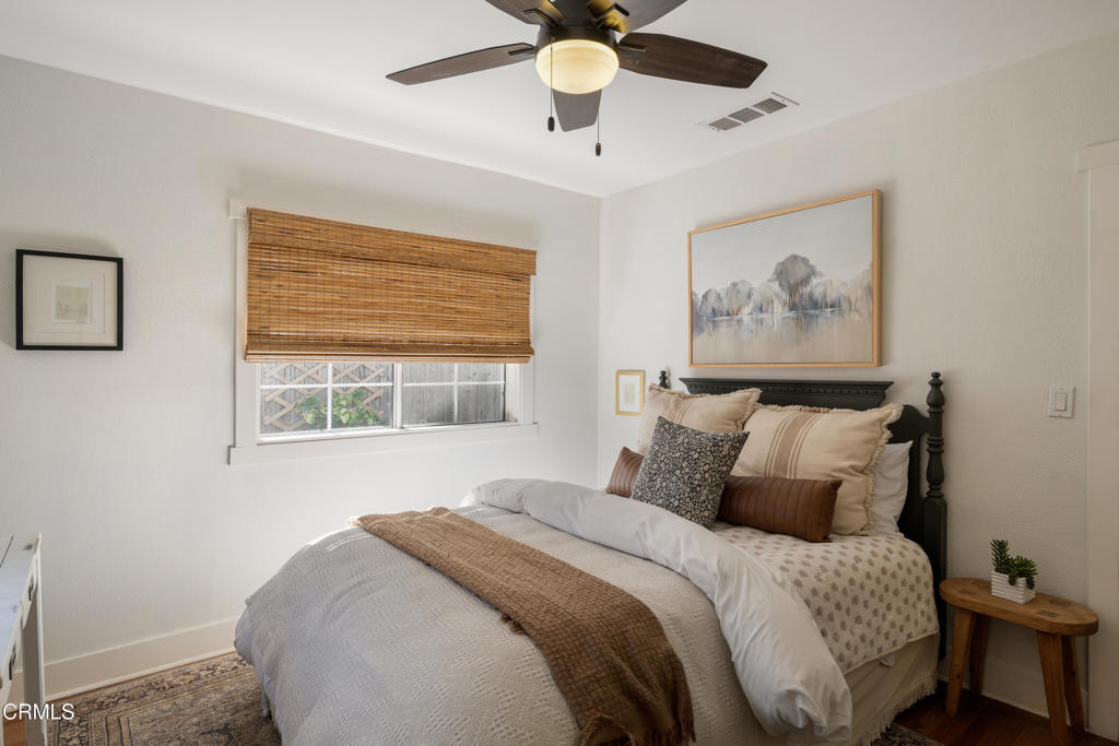 640 East Rio Grande Street Pasadena, CA 91104 - Photo 34 of 61 a bedroom with a bed and a painting on the wall