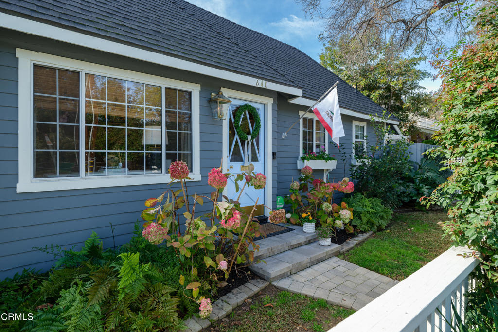 640 East Rio Grande Street Pasadena, CA 91104 - Photo 59 of 61 a front view of a house with a yard and potted plants