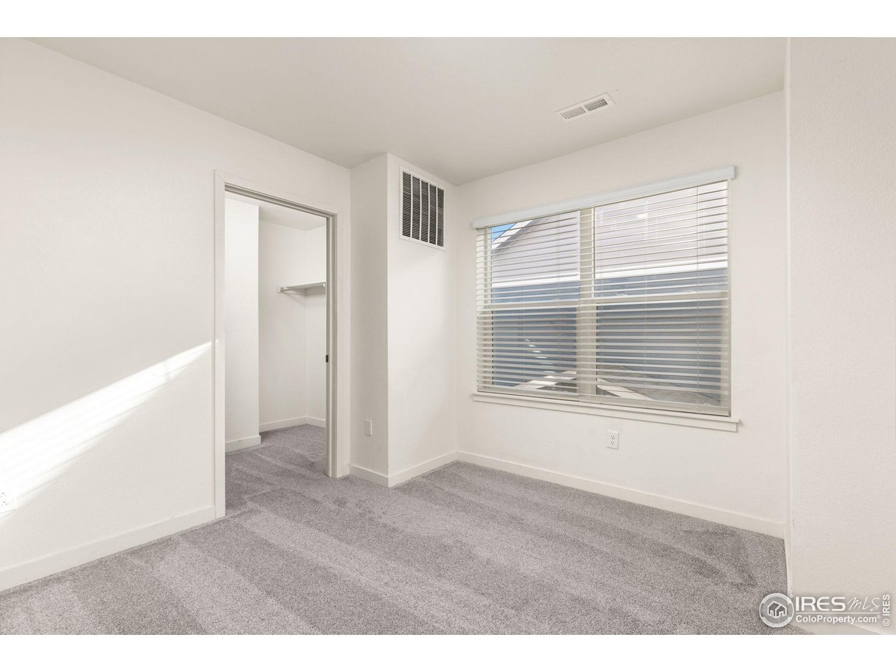 212 Swallow Road Johnstown, CO 80534 - Photo 28 of 32 Bedroom 5 with an extra large walk-in closet.