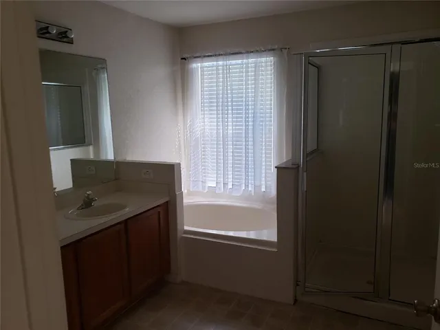 a bathroom with a sink and a bathtub