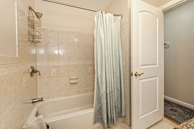 a bathroom with a shower and a tub