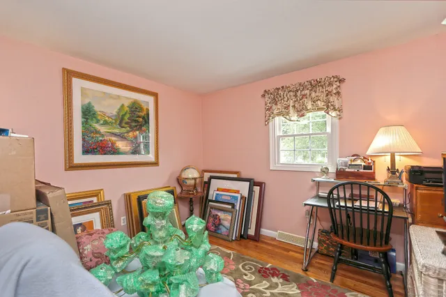 a bedroom with furniture and a window
