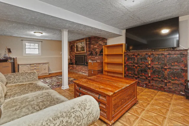 a living room with couch and a flat screen tv