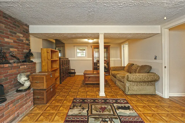 a living room with furniture and a rug