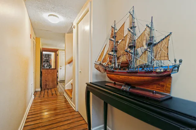 a view of a living room and wooden floor