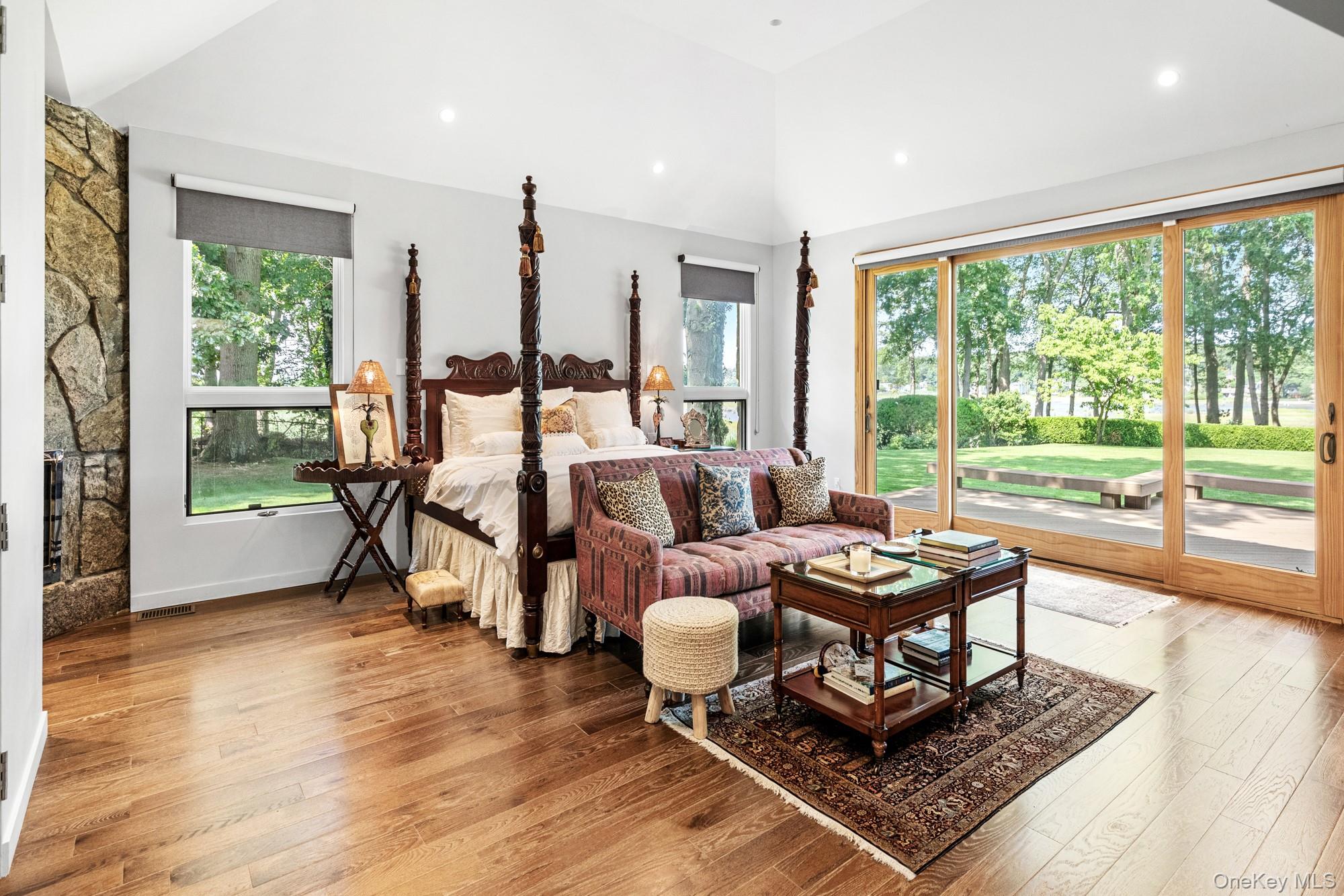 8 Mill Pond Lane Locust Valley, NY 11560 - Photo 13 of 38 a living room with furniture and a floor to ceiling window
