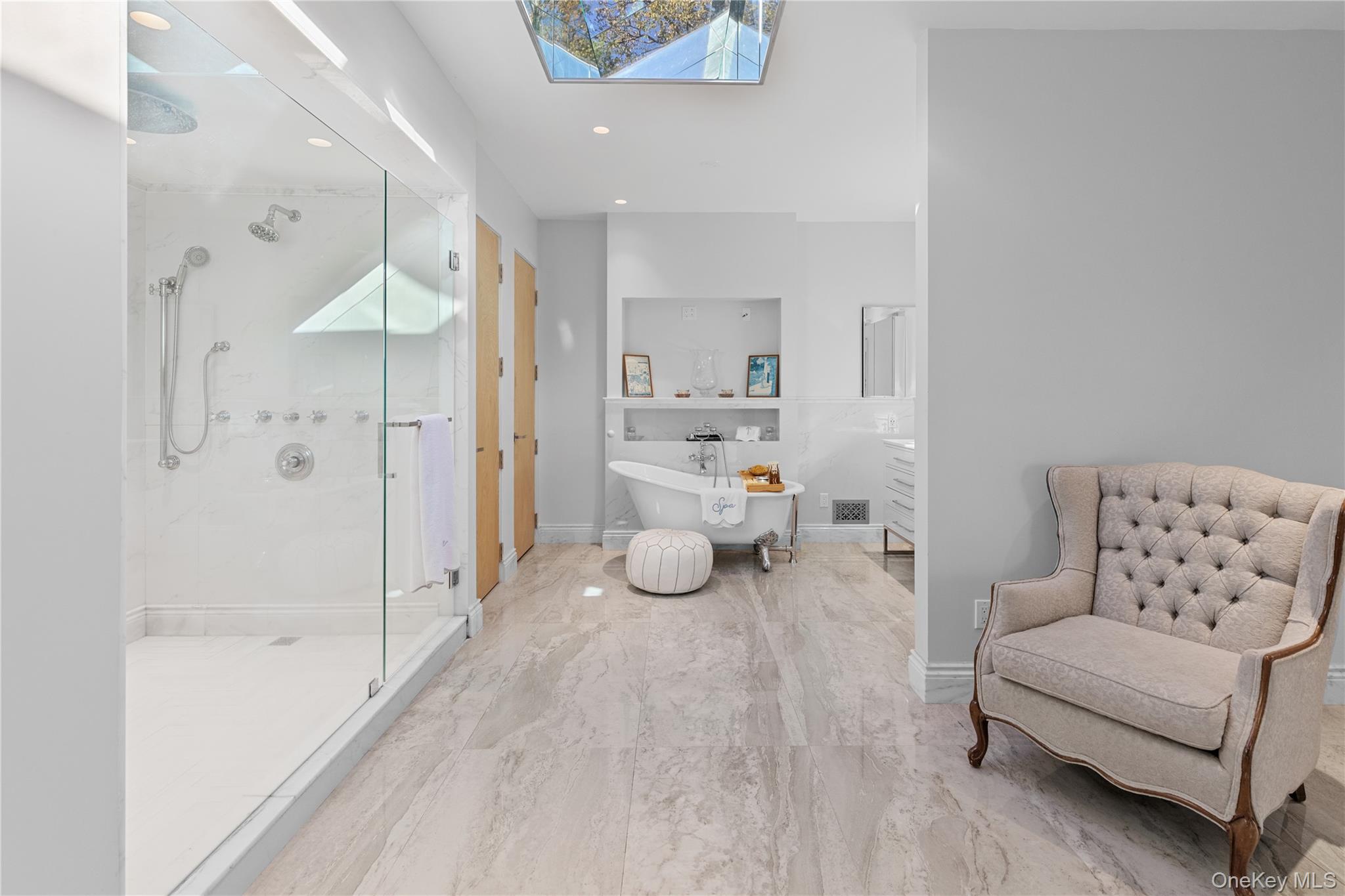 8 Mill Pond Lane Locust Valley, NY 11560 - Photo 14 of 38 a bathroom with a bathtub shower sink and toilet