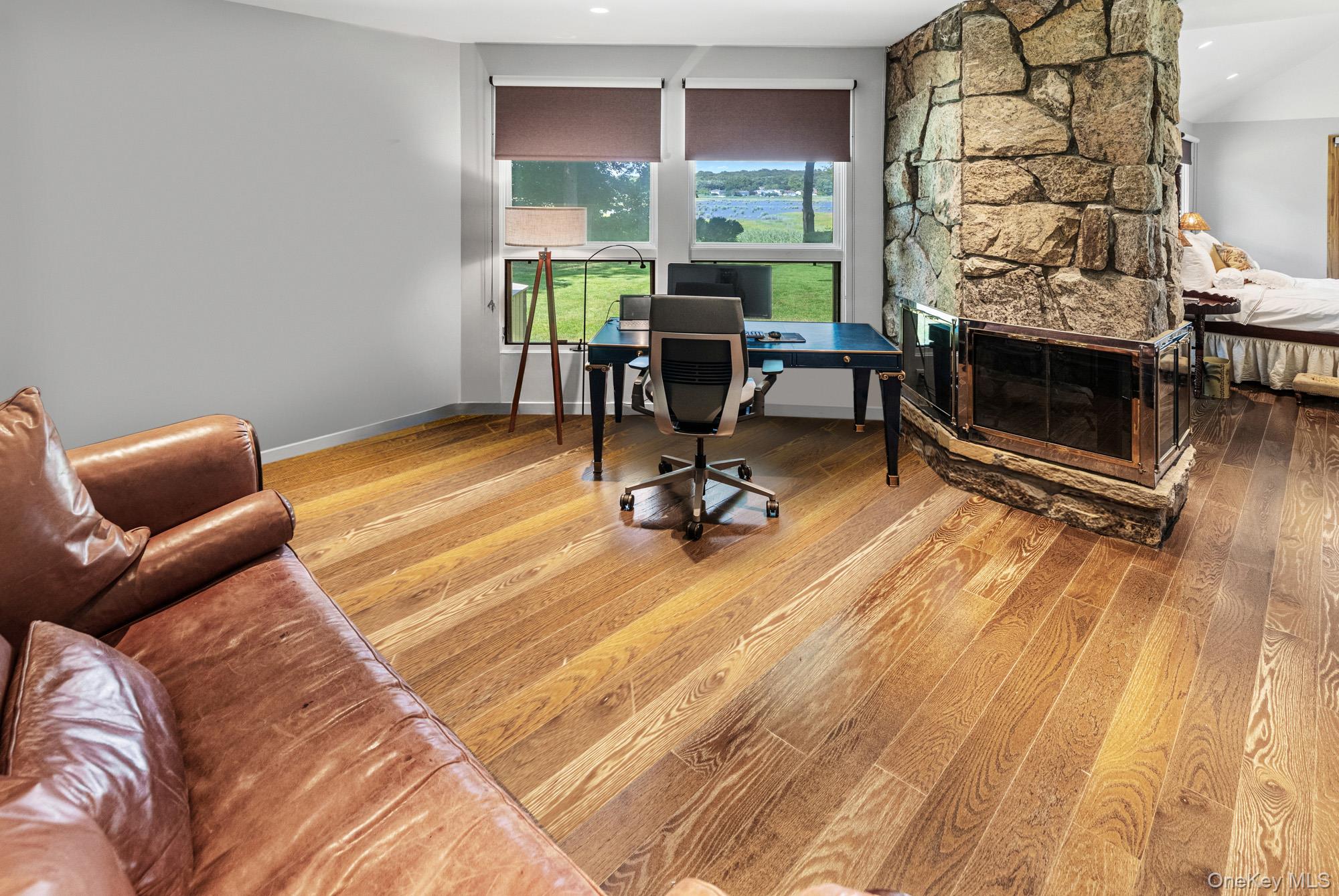 8 Mill Pond Lane Locust Valley, NY 11560 - Photo 17 of 38 a view of a livingroom with workspace and a window