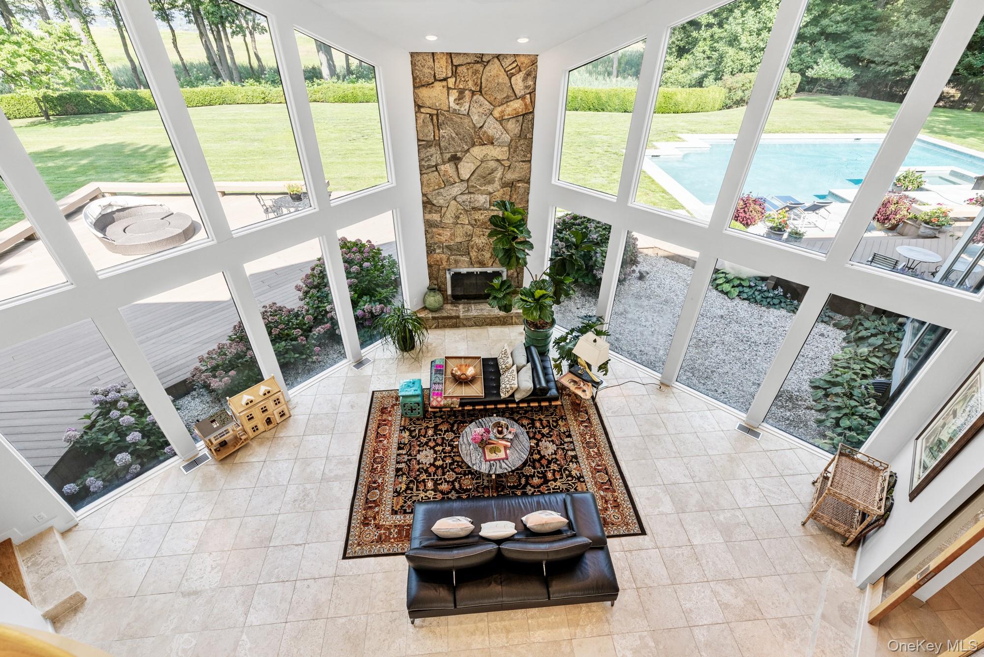 8 Mill Pond Lane Locust Valley, NY 11560 - Photo 18 of 38 a living room with furniture and a large window