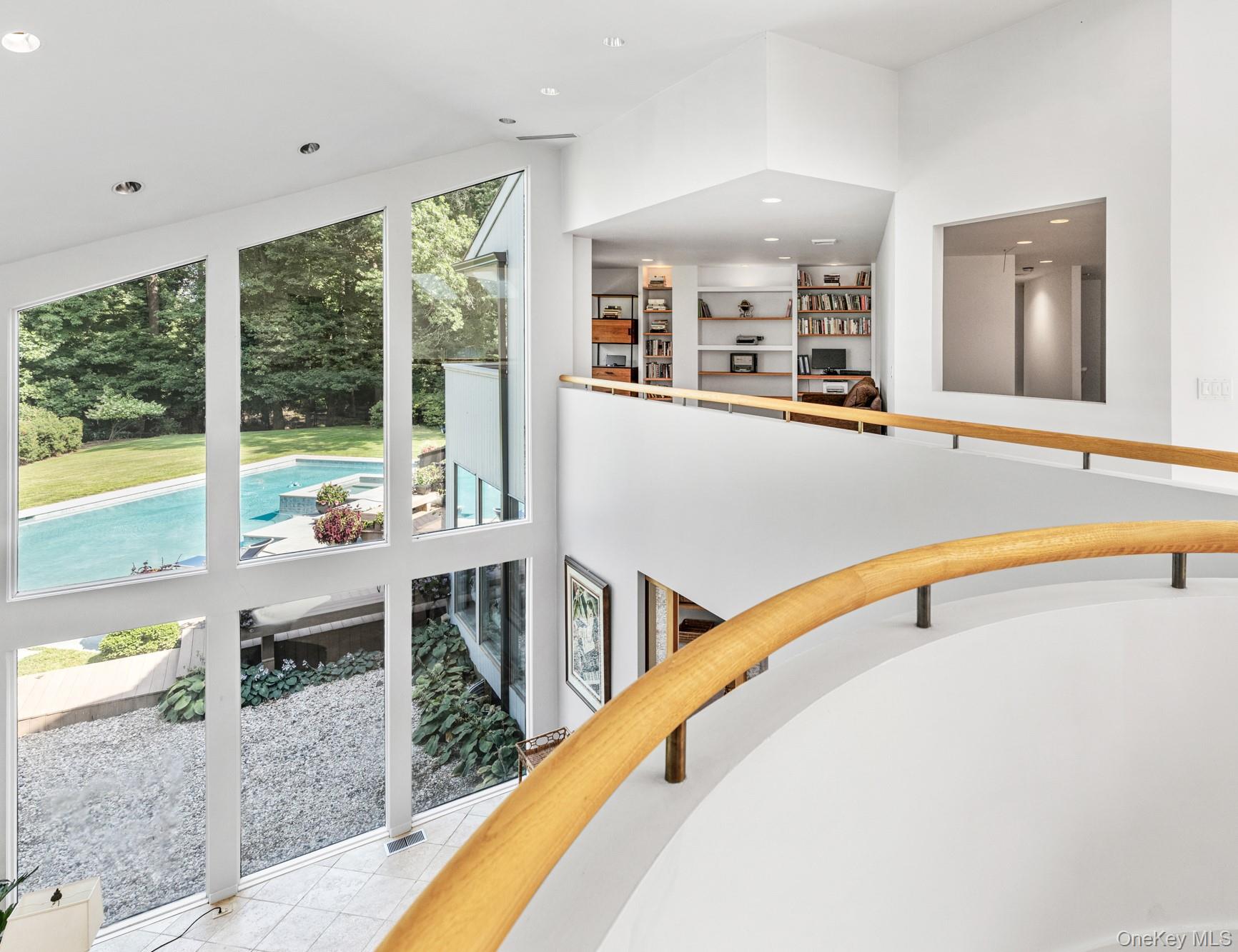 8 Mill Pond Lane Locust Valley, NY 11560 - Photo 19 of 38 a view of a living room and balcony