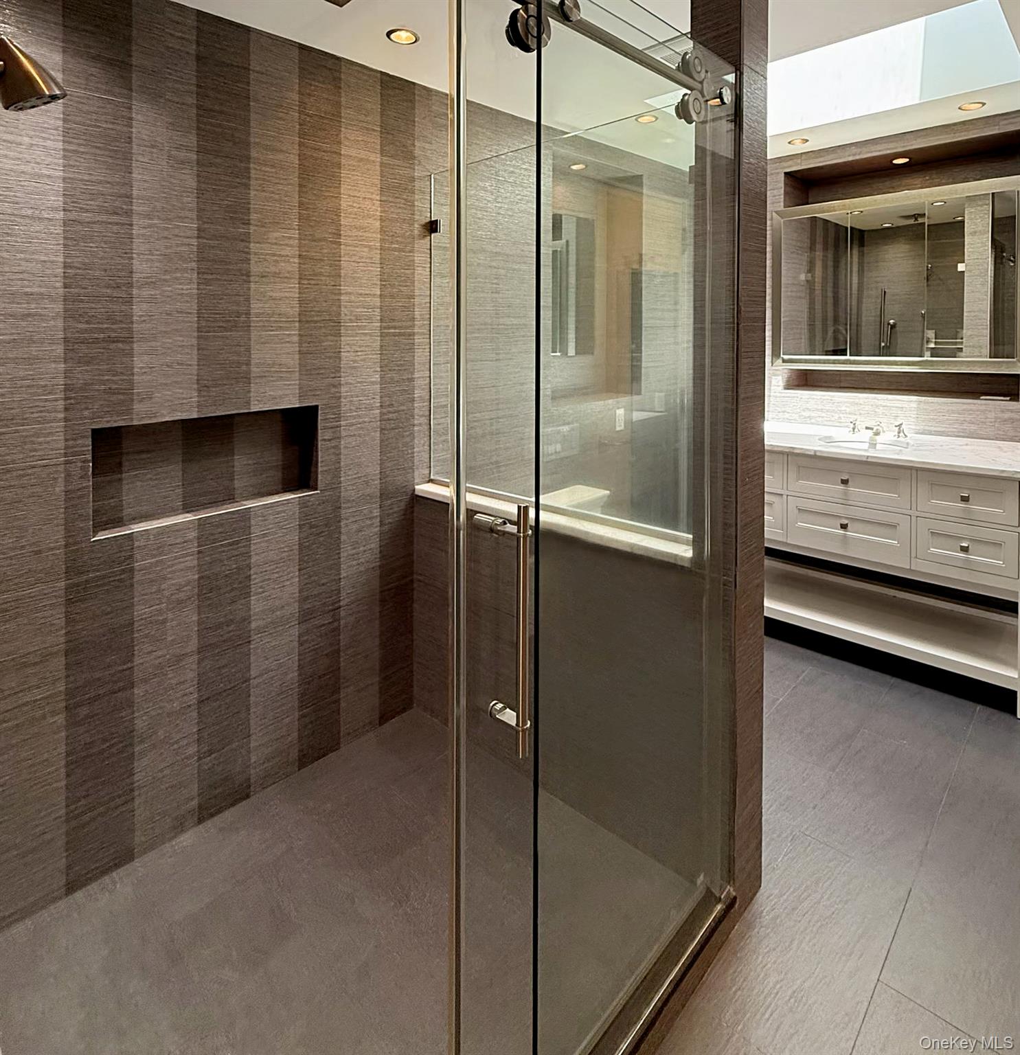 8 Mill Pond Lane Locust Valley, NY 11560 - Photo 22 of 38 a bathroom with a shower and a sink